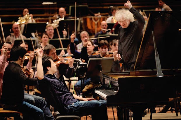 This charming man: Lang Lang rehearsing with Sir Simon Rattle and the Berlin Philharmonic