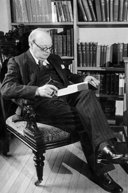 Churchill reading in his library at Chartwell