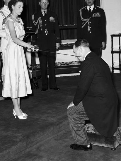 Sword of honour: Queen Elizabeth II knights Sir Garfield Barwick at Government House in Sydney, 6 February 1954, during her royal tour of Australia