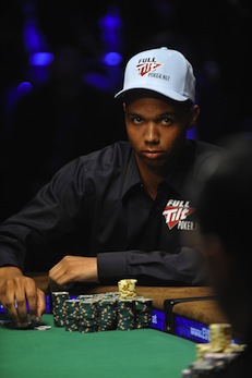 Phil Ivey pauses during a hand at the fi