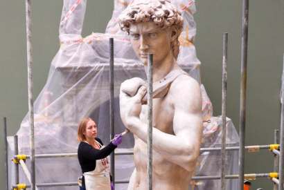 Conservator Johanna Puisto dusts the cast of Michelangelo’s ‘David’ post-conservation, November 2014