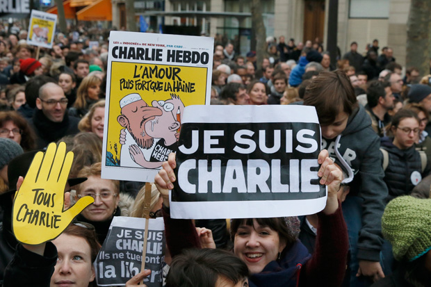 Demonstrators wave posters reading ‘Je suis Charlie (I am Charlie)’, during the Unity rally Marche Republicaine in Paris in tribute to the 17 victims of the Charlie Hebdo killing spreeby three Islamist terrorists.