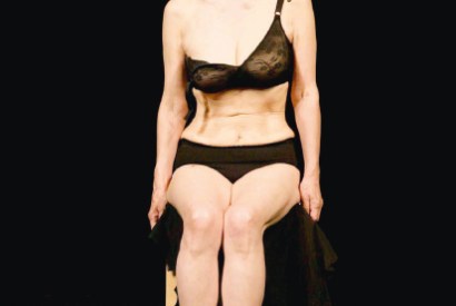 Yoko Ono performing ‘Cut Piece’, where her outfit is cut down to her underwear by predatory snipping scissors