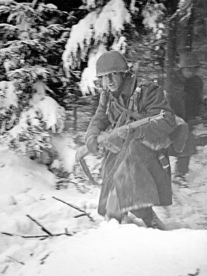Out of the woods: American forces attack a German machine gun post, December 1944. The grim determination of the Allies, whose heroism kept the Germans at bay, helped pave the way for the final Russian advance on Berlin