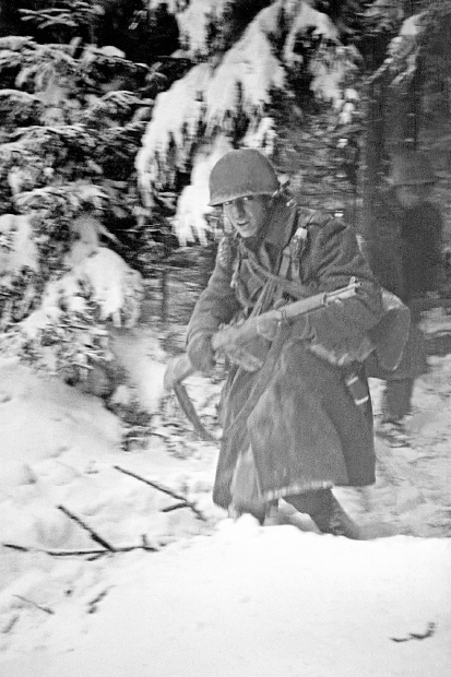 Out of the woods: American forces attack a German machine gun post, December 1944. The grim determination of the Allies, whose heroism kept the Germans at bay, helped pave the way for the final Russian advance on Berlin