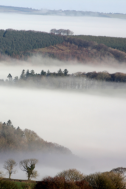 Morning mist in the valleys of northeast Dartmoor, seen from the summit of Brent Tor