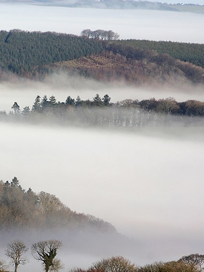 Morning mist in the valleys of northeast Dartmoor, seen from the summit of Brent Tor