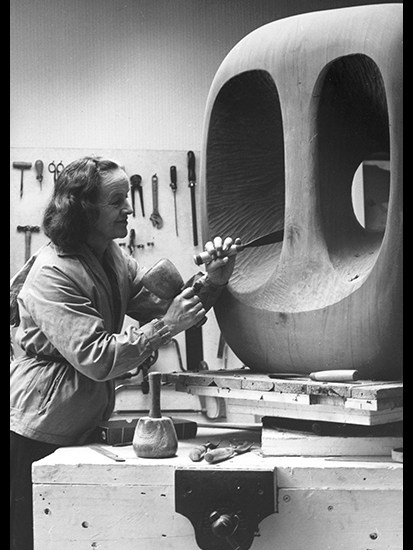 Barbara Hepworth in the Palais de la Danse studio, St Ives, at work on the wood carving ‘Hollow Form with White Interior’, 1963