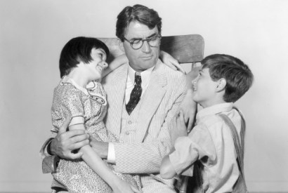Atticus Finch (played by Gregory Peck) with his children Scout and Jem in the 1962 film version of To Kill a Mockingbird.
