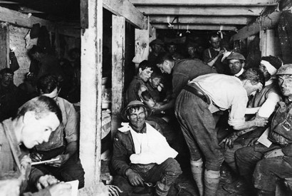 British soldiers having wounds treated in an underground dressing station by the Menin Road in France. (Photo by Frank Hurley/Three Lions/Getty Images)