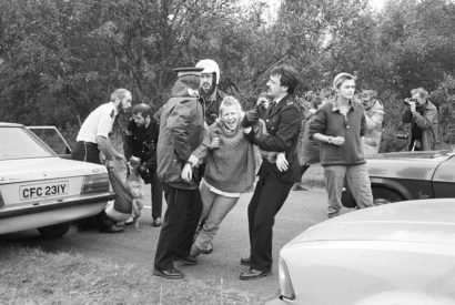 A demonstrator is arrested during an anti-nuclear protest at Greenham Common air base in 1983. (Photo: D. Jones/Express/Getty)