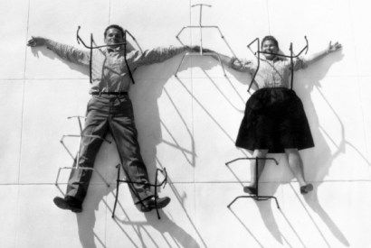 Hot seats: Charles and Ray Eames posing with chair bases