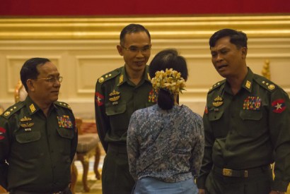 Aung San Suu Kyi with military officials at the swearing-in of President Htin Kyaw, 30 March 2016