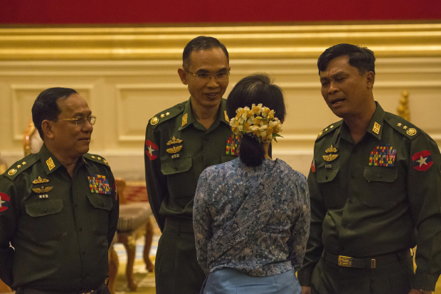 Aung San Suu Kyi with military officials at the swearing-in of President Htin Kyaw, 30 March 2016