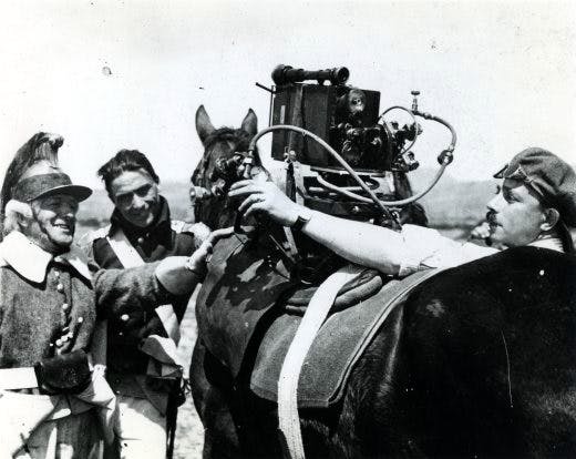 Crew mounting a camera on a horse for Gance's Napoleon. Photo: Photoplay/BFi