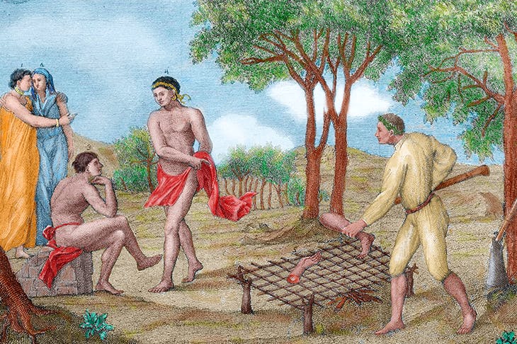 Maipure Indians, inhabitants of the Upper Orinoco, grill the limbs of a dead enemy (Italian engraving, 1781)