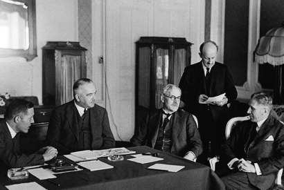 The brisk, implacable Sir Maurice Hankey (second from right) stands between Ramsay Macdonald and Franz von Papen at the Reparations Conference in Lausanne in 1932