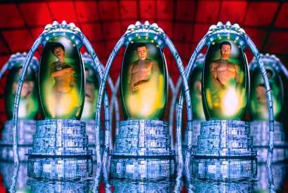 A computer illustration of people in cryogenic pods