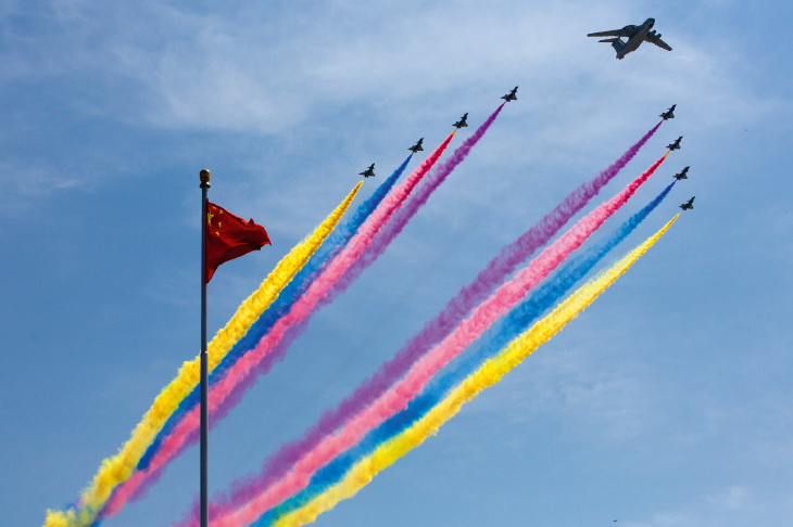 An airborne early warning system leads fighter jets during a military parade in Beijing