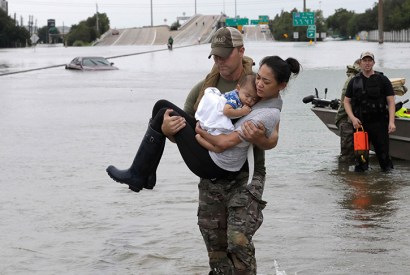 Safe: Catherine Pham and her baby son are rescued in Houston