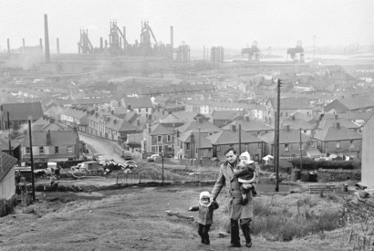 An out-of-work steel worker walking through Port Talbot, 1964