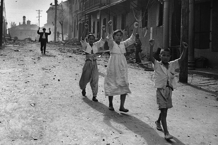 The Korean war was the single greatest calamity of the period. Residents of Inchon surrender to American troops in 1950