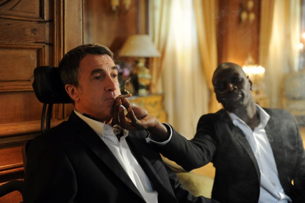 François Cluzet as paraplegic billionaire Philippe and Omar Sy as his carer Driss in Untouchable (2011)