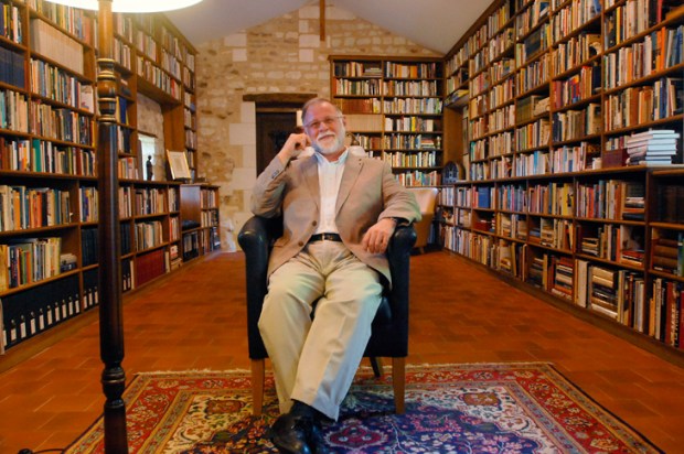 Portrait of the reader as devoted book-owner: Alberto Manguel in happier days, at home in his library in France