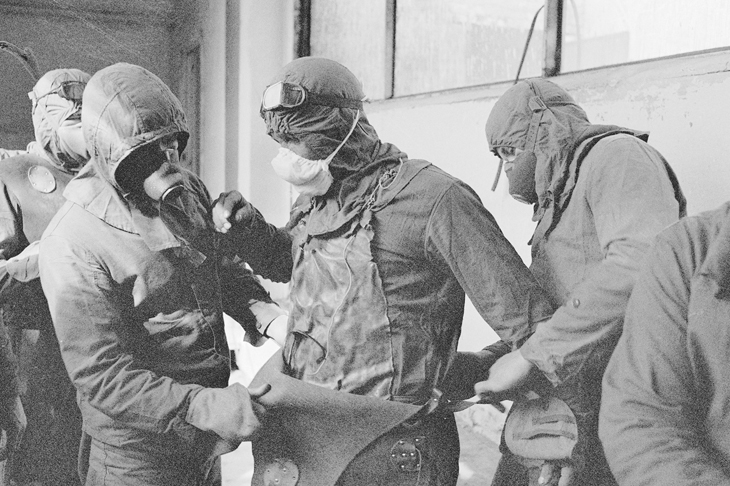 Clean-up workers, known as ‘roof cats’, prepare to remove radioactive debris with shovels and handbarrows from the damaged reactor, October 1968