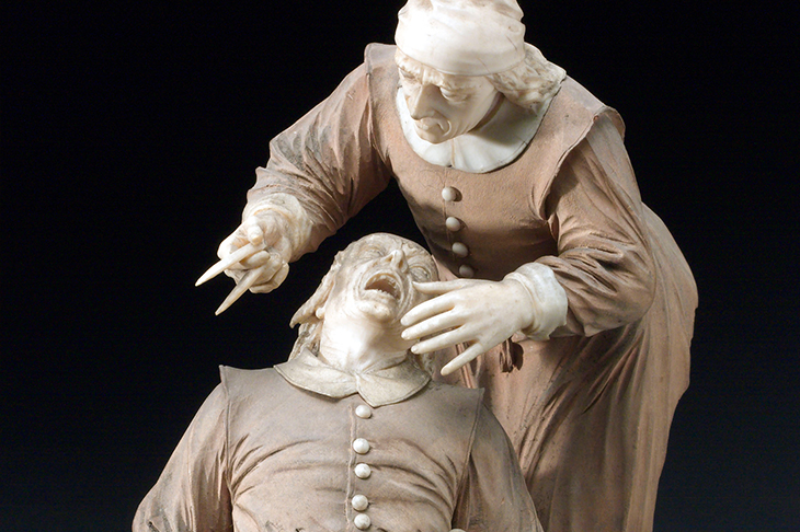 Wood and ivory figure group depicting a tooth extraction, 17th century