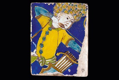 A cuerda seca tile made of stone paste, showing the figure of an archer. Safavid dynasty, early 17th century (From The History of Central Asia)