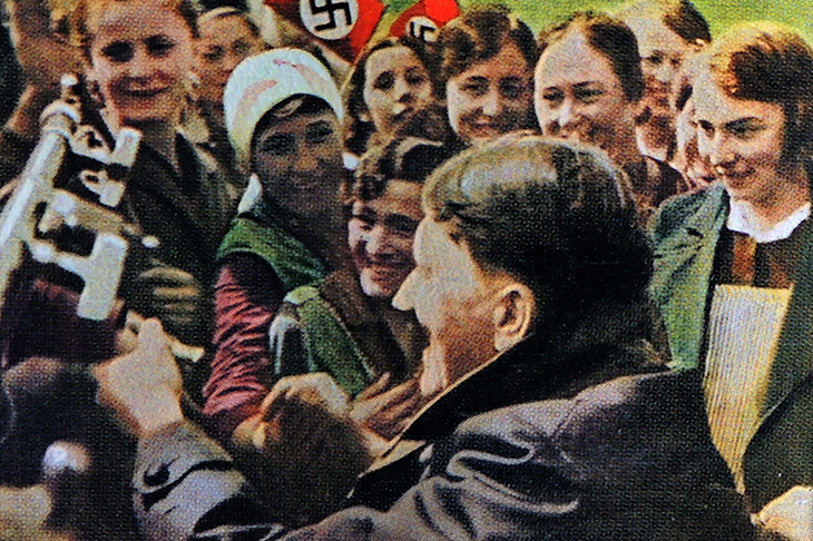 Female Nazi supporters greet Hitler after his election as chancellor in 1933. Credit: Getty Images