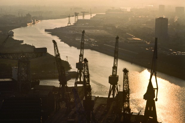 Sunset on the Clyde, 1984. The massive cranes used to build the Lusitania, HMS Hood, the Queen Mary and the QE2 are relics of the once great maritime industry of Port Glasgow