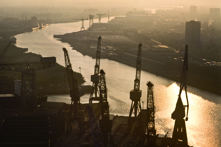 Sunset on the Clyde, 1984. The massive cranes used to build the Lusitania, HMS Hood, the Queen Mary and the QE2 are relics of the once great maritime industry of Port Glasgow