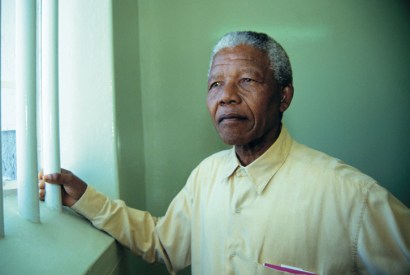 Mandela revisits his prison cell on Robben Island in 1994 [Getty]