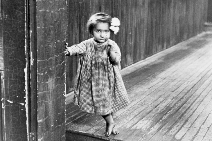 Photograph of an almshouse waif by Lewis W. Hine, entitled ‘Little Orphan Annie in a Pittsburg Institution’ (1909) [Bridgeman Art Library]