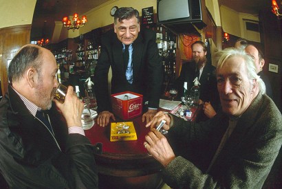 Jeffrey Bernard and Christopher Howse among drinkers at the Coach and Horses. Norman Balon presides. Credit: Rex Features