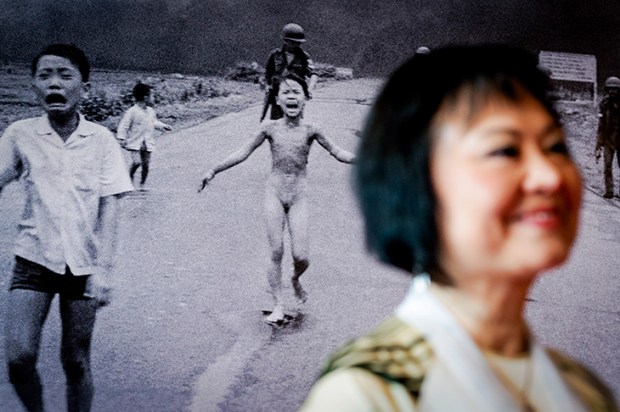 Kim Phuc Phan Thi – Napalm Girl – stands in front of the iconic 1972 photograph that changed public opinion worldwide