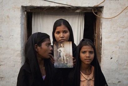 Asia Bibi’s daughters with a picture of their mother
