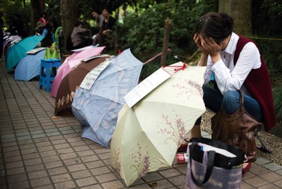 A woman advertises for a partner for her child in Shanghai’s People’s Park