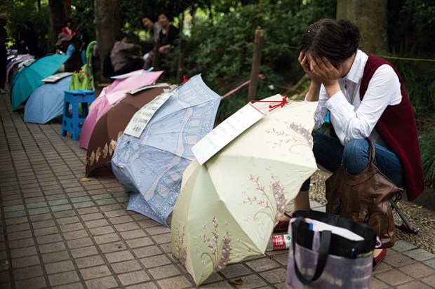A woman advertises for a partner for her child in Shanghai’s People’s Park