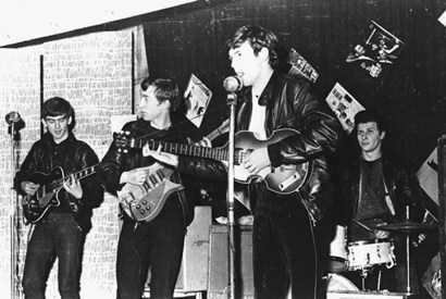 The Beatles perform in Liverpool prior to signing their first recording contract: George Harrison, John Lennon, Paul McCartney, and original drummer Pete Best. Photo: Hulton Archive / Getty Images