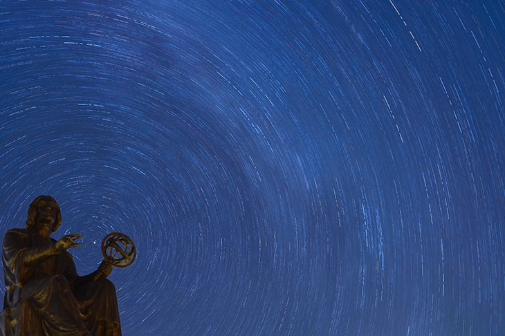Stars rotate behind the Copernicus Monument in Chicago. Credit: Getty Images
