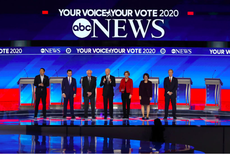 Andrew Yang, Pete Buttigieg, Bernie Sanders, Joe Biden, Elizabeth Warren, Amy Klobuchar and Tom Steyer at the DNC debate in Manchester, New Hampshire