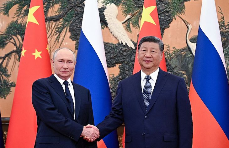 Why is Putin so happy in China?